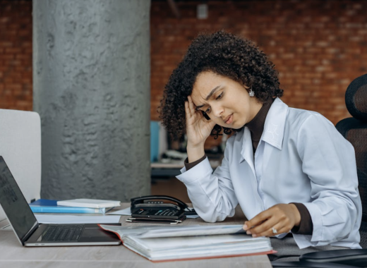 Frustrated Woman Looking at Her Business Finances
